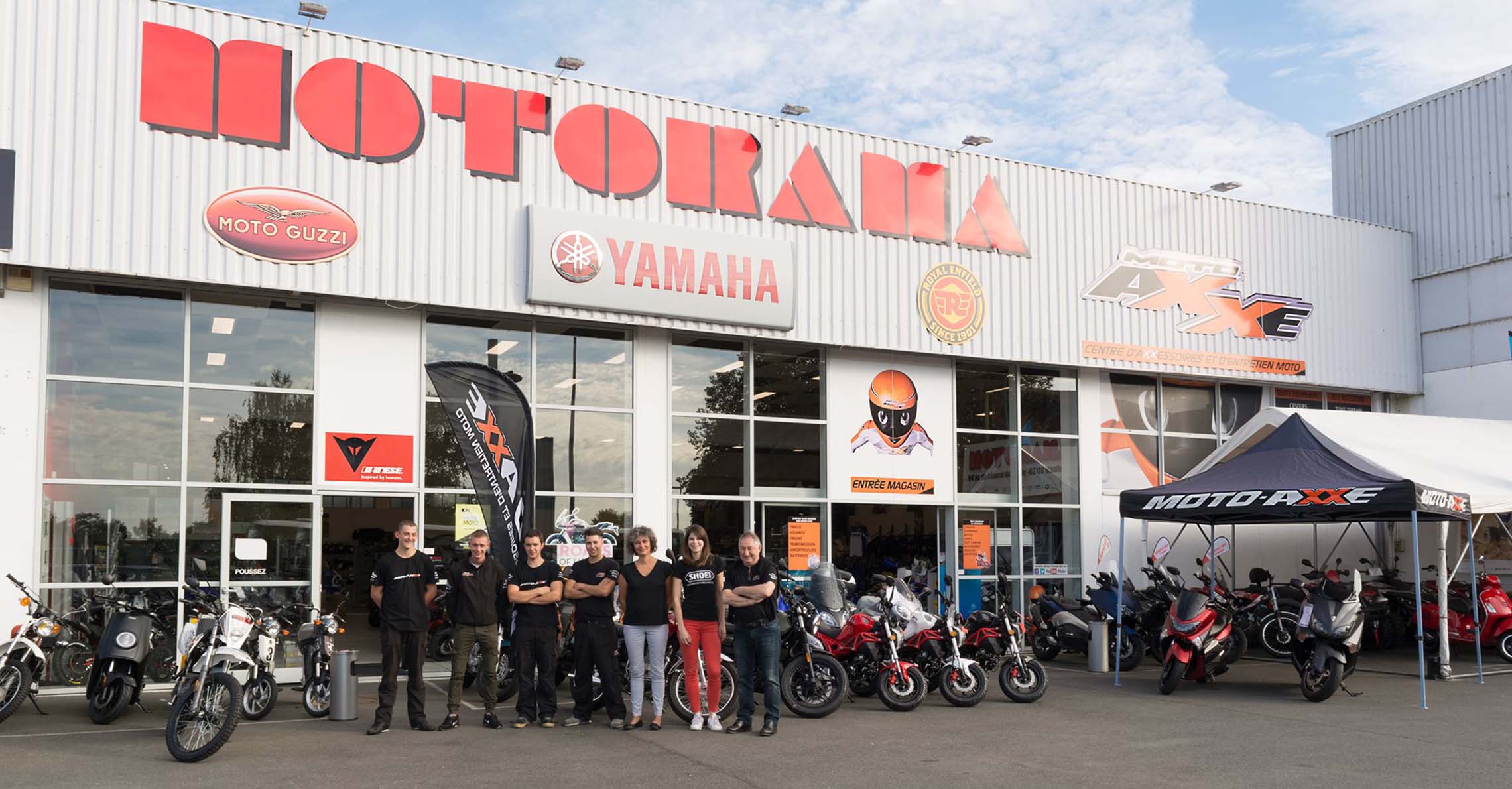 Motorama team standing in front of the shop